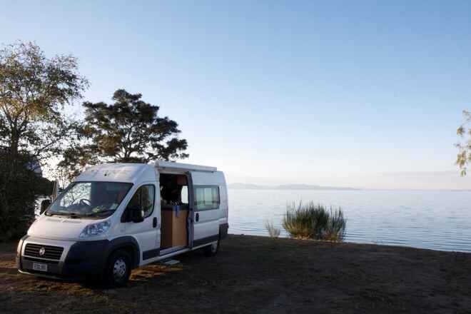 Enjoying a still morning by the lake in a Gateway Campervan