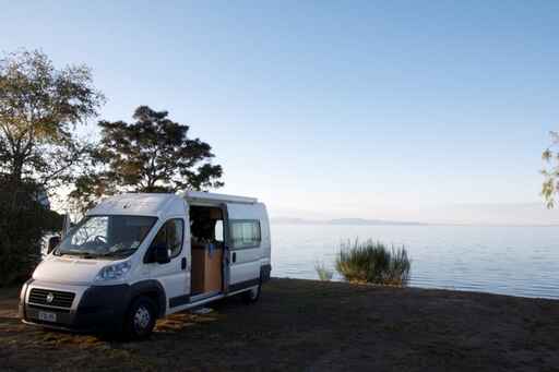 Enjoying a still morning by the lake in a Gateway Campervan