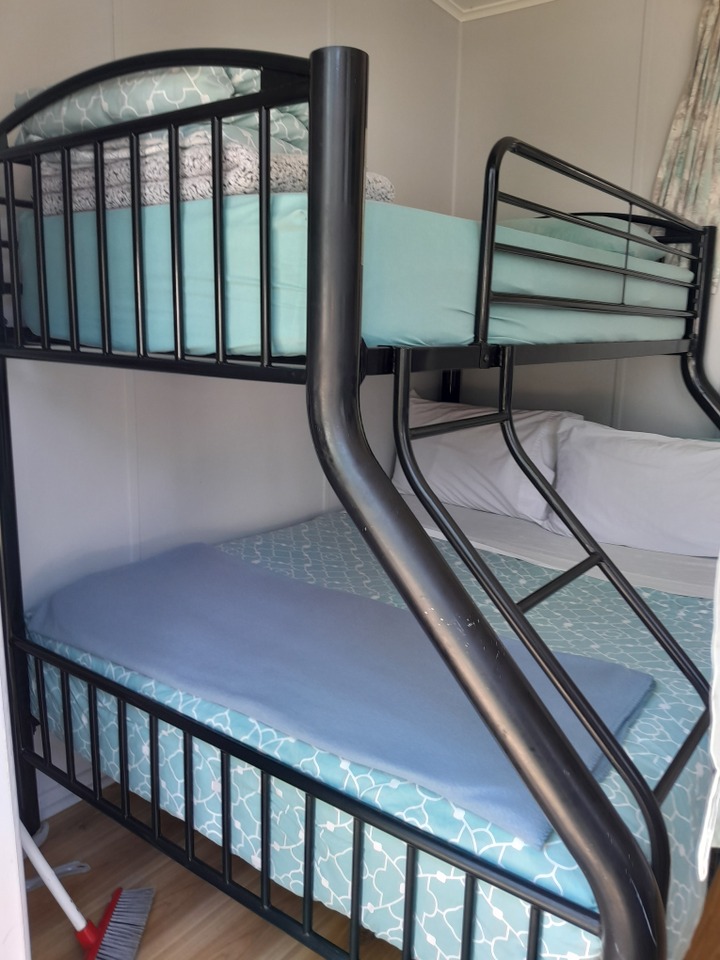 Queen and single bunks in Kitchen cabins.